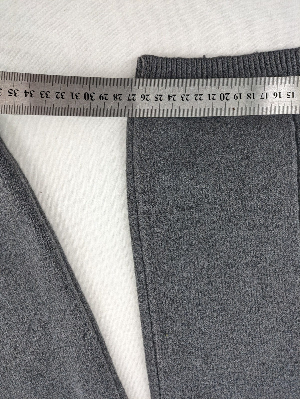 Grey pants with cable knit pattern, wide leg, ribbed waistband, 100% polyester.