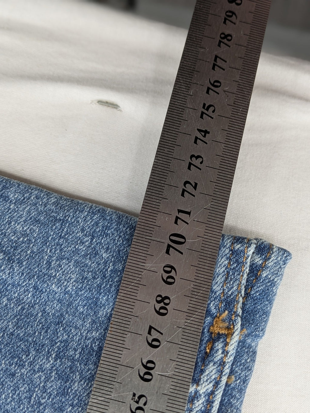 QS by s.Oliver green bootcut jeans with ankle zippers and classic denim wash.