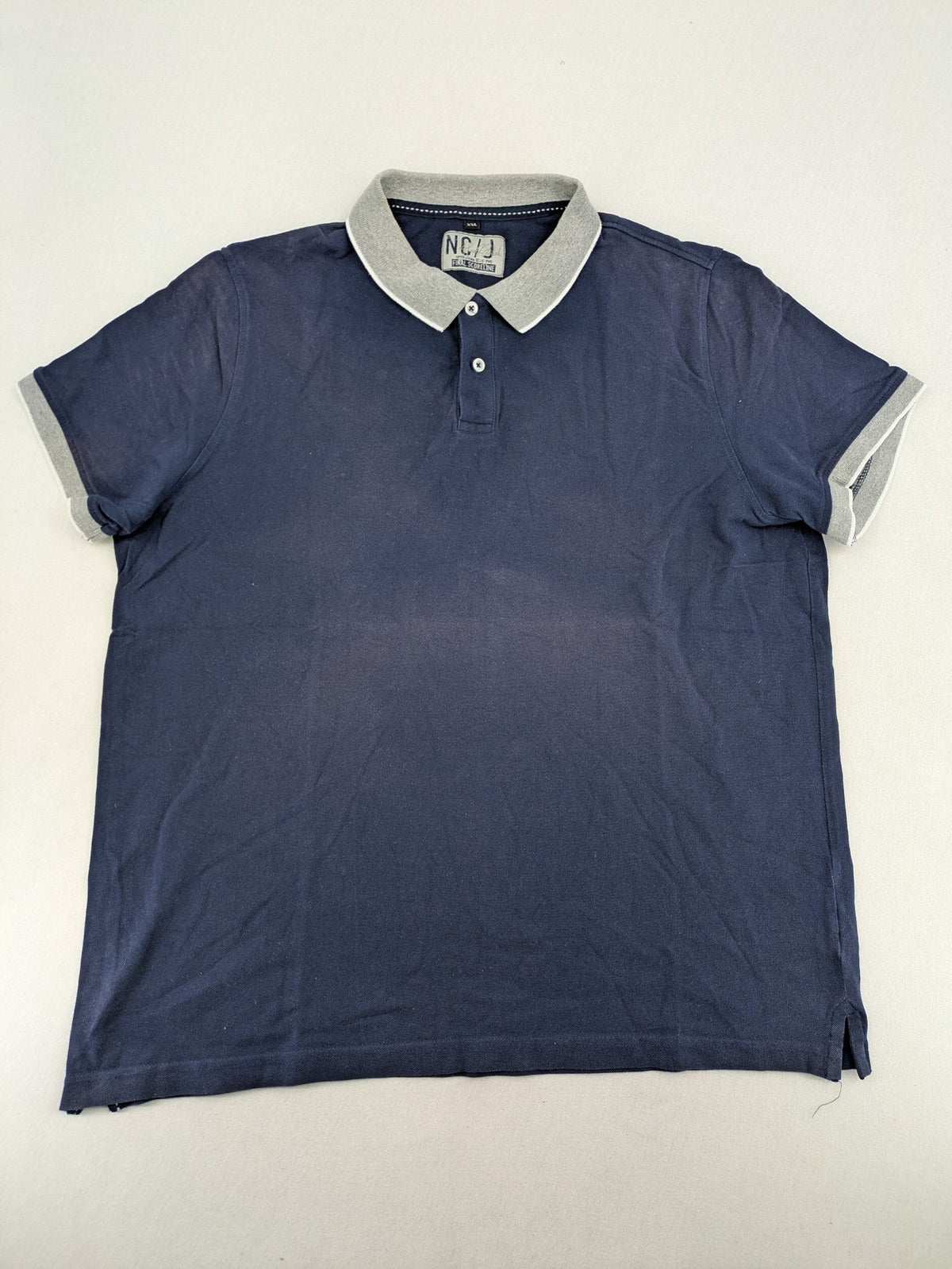 XXL navy polo shirt with grey contrast collar and cuffs, 100% cotton material.