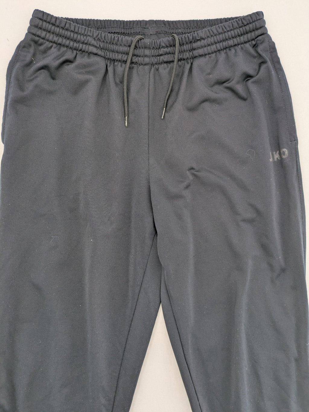Jako black jogging pants with elastic waistband and ribbed ankle cuffs.