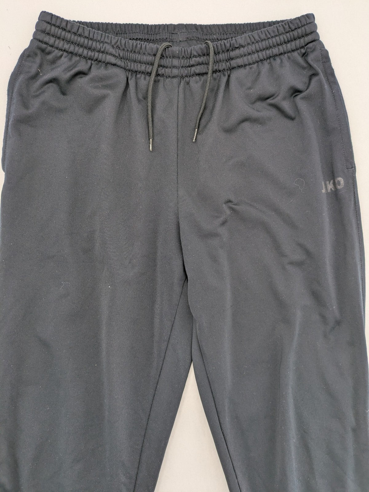 Jako black jogging pants with elastic waistband and ribbed ankle cuffs.