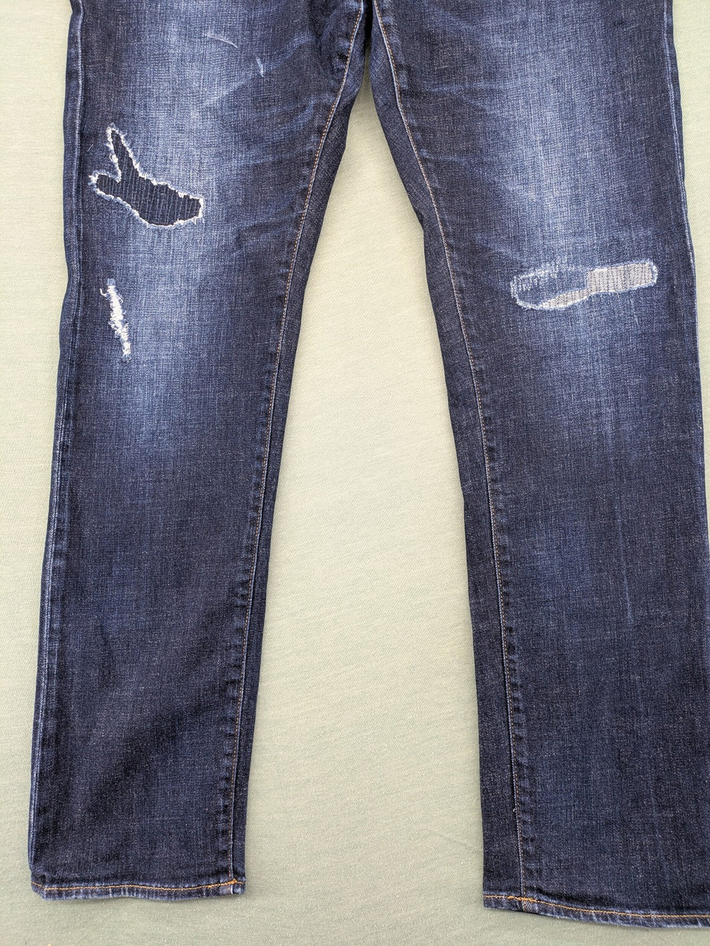 Armani Exchange blue slim fit jeans with distressed details and classic 5-pocket design.