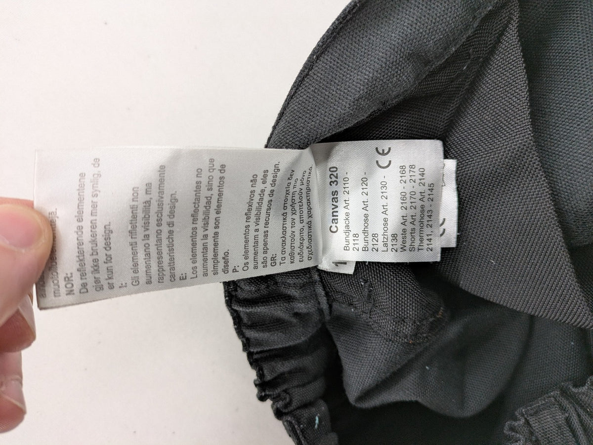 Planam work trousers black canvas with Cordura knee reinforcement and cargo pockets.