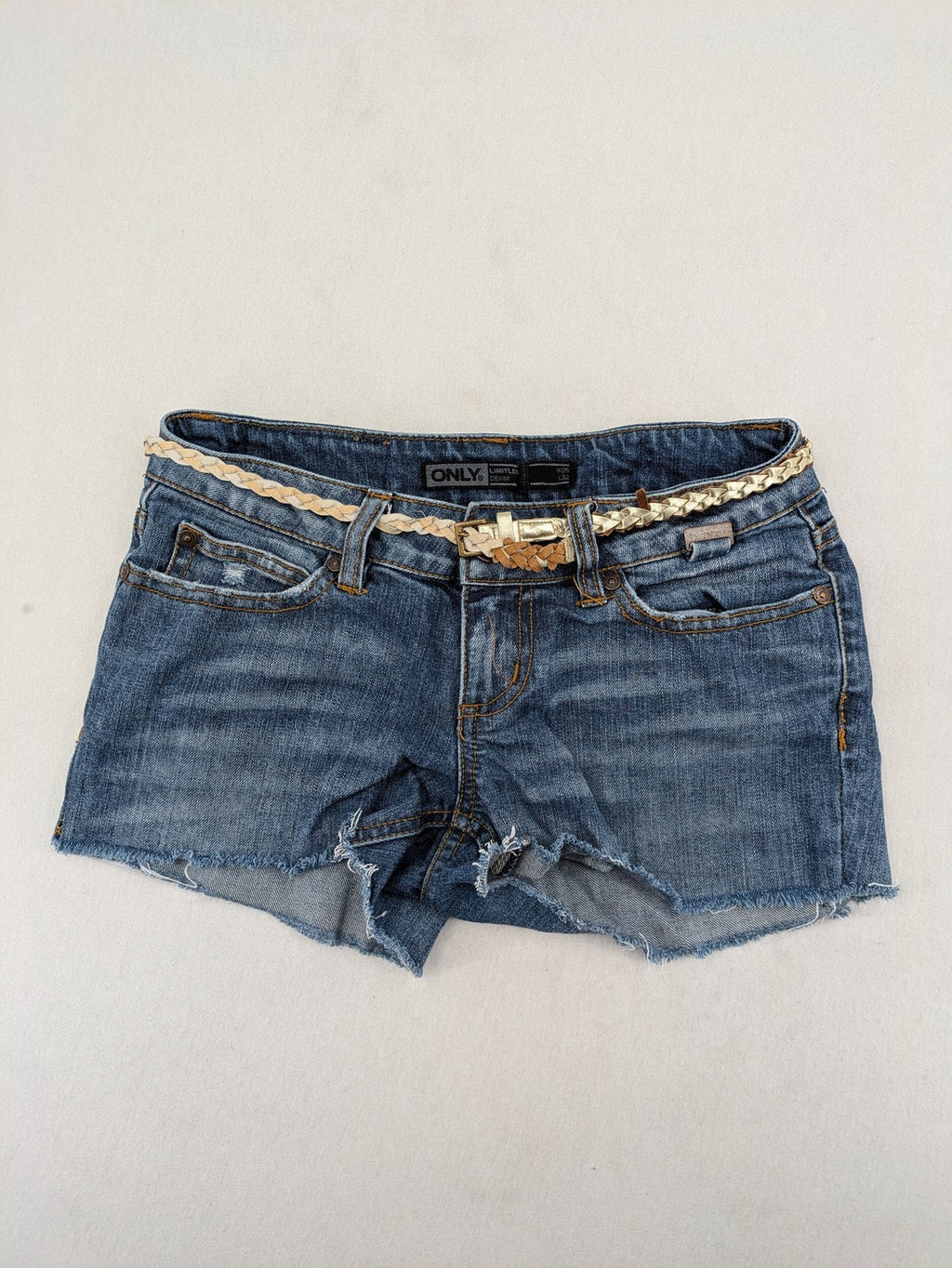 ONLY cream denim shorts with frayed hem and decorative braided gold belt
