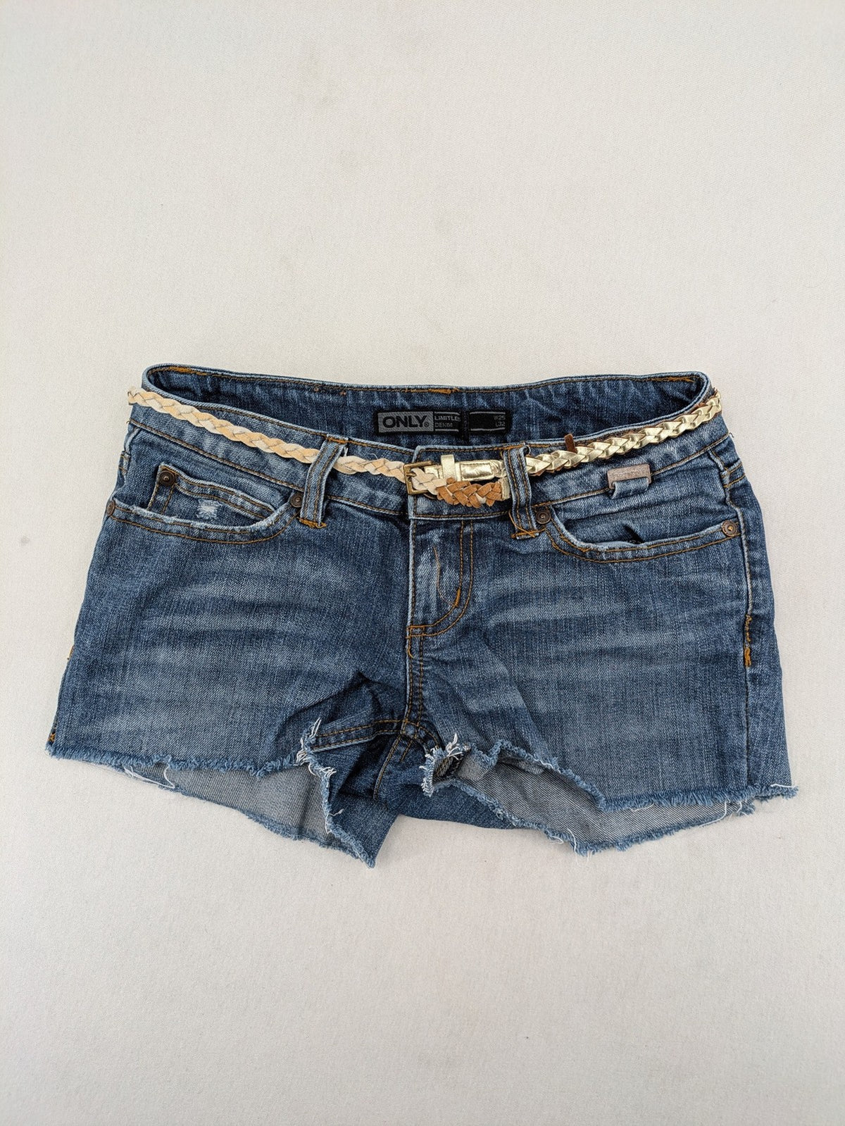 ONLY cream denim shorts with frayed hem and decorative braided gold belt