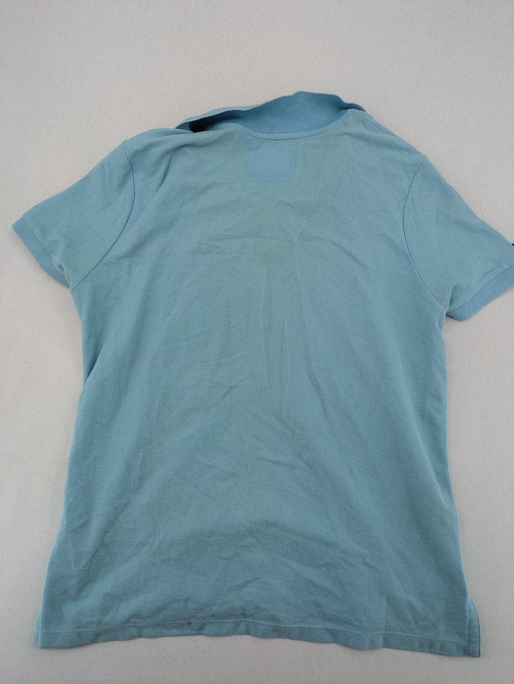 Lee Cooper blue polo shirt with embroidered logo and Union Jack patch on sleeve.