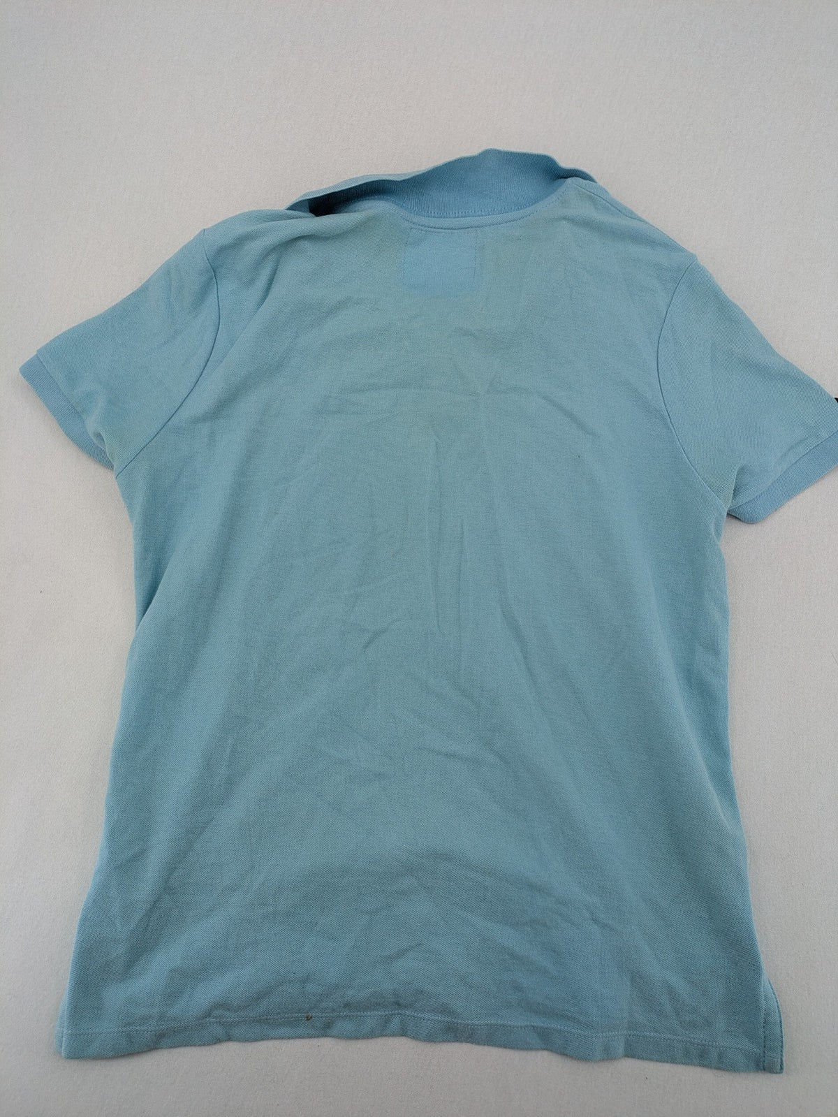 Lee Cooper blue polo shirt with embroidered logo and Union Jack patch on sleeve.