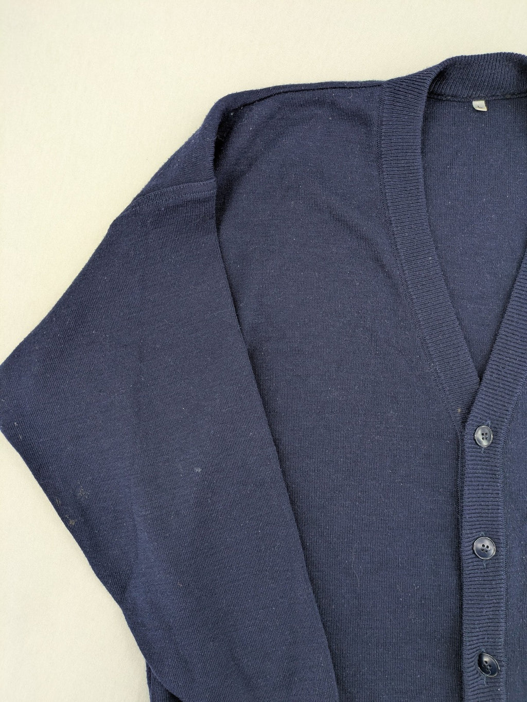 Schurwolle navy knit jumper classic V-neck with button placket, made from wool blend.