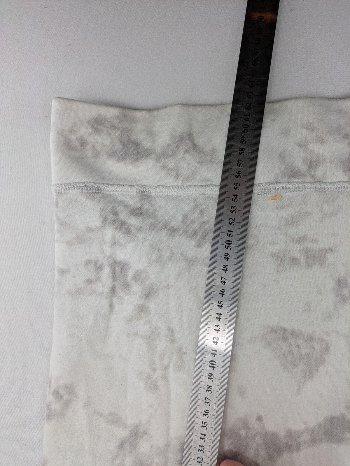 Hollister grey and white tie-dye hoodie with logo on chest, back, and sleeve.
