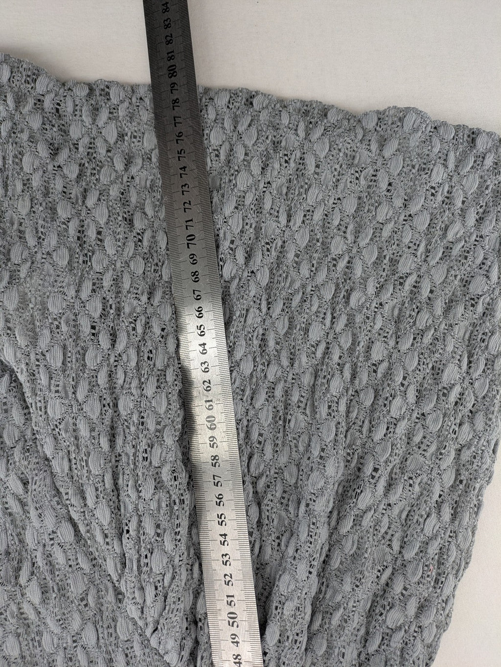 Zara grey mini dress with V-neck, puff sleeves, and textured fabric pattern.
