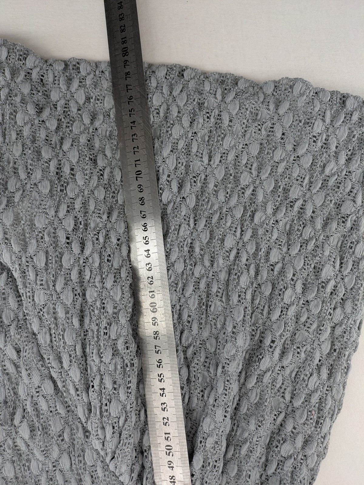 Zara grey mini dress with V-neck, puff sleeves, and textured fabric pattern.