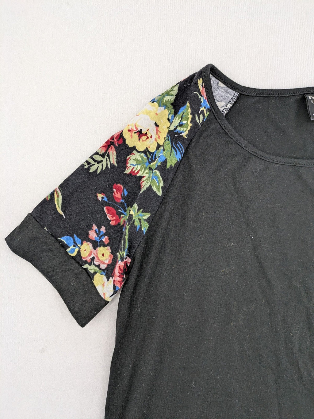 Emery Rose pink T-shirt with floral raglan sleeves and round neckline.