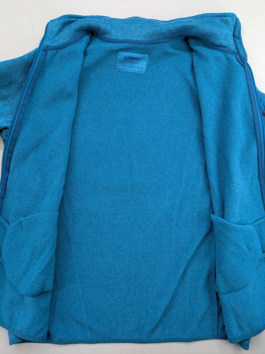 Stooker blue and turquoise fleece jacket with full zip and stand-up collar.
