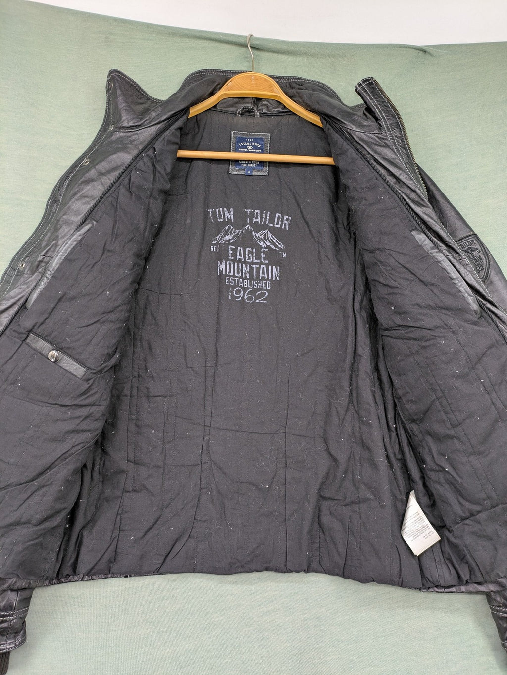 Tom Tailor black leather jacket vintage style with multiple pockets and contrast stitching.