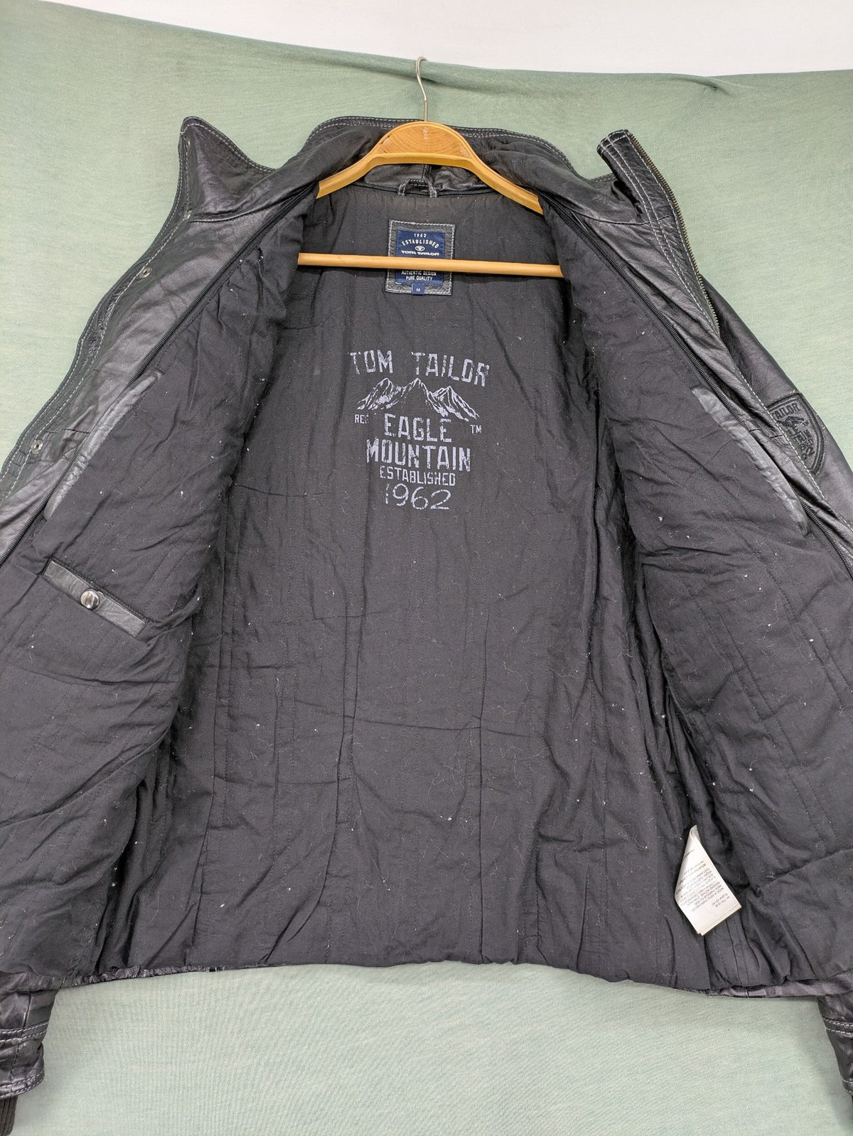 Tom Tailor black leather jacket vintage style with multiple pockets and contrast stitching.
