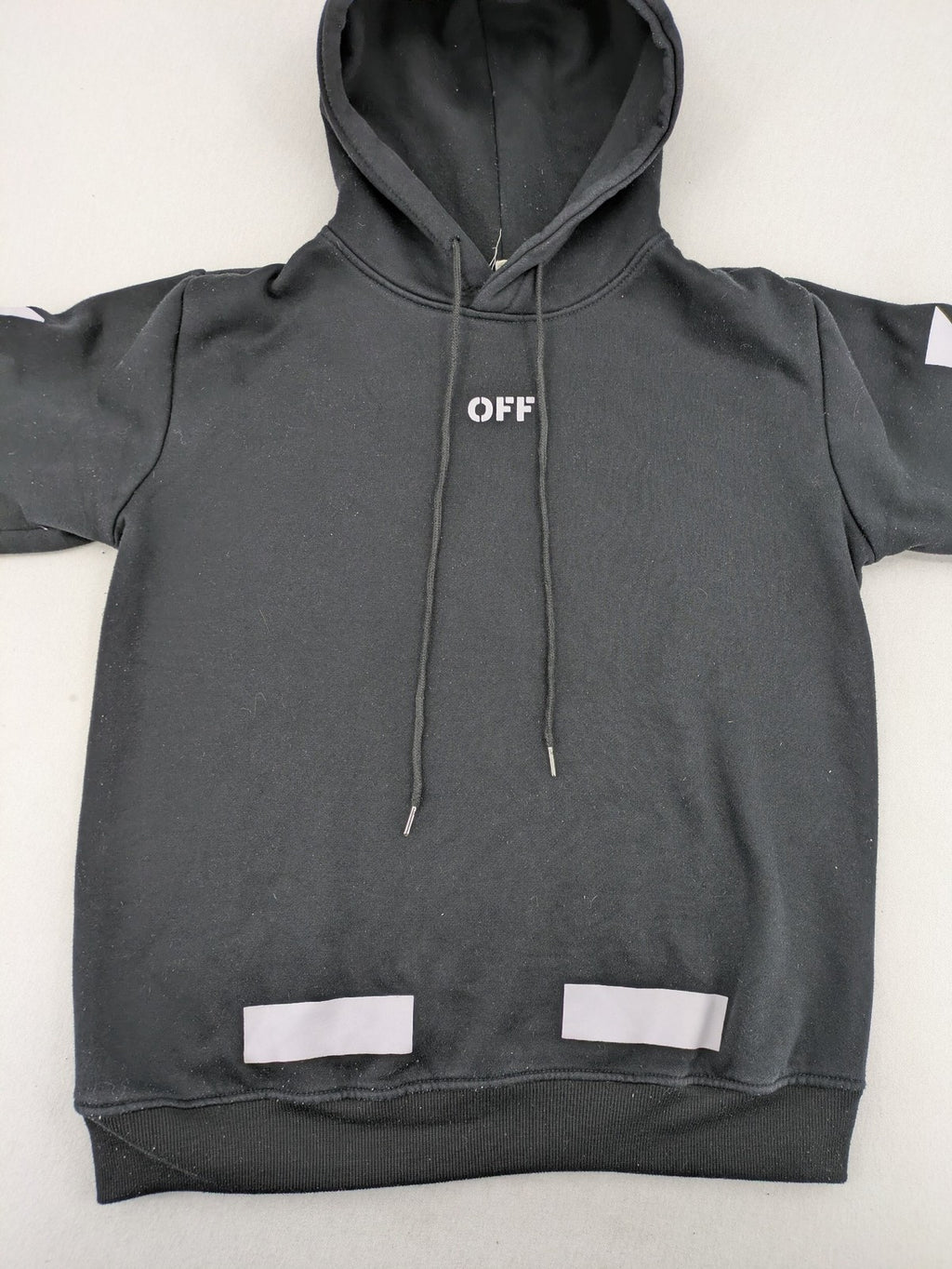Off-White white zip-through hoodie with diagonal stripes and large arrows graphic.