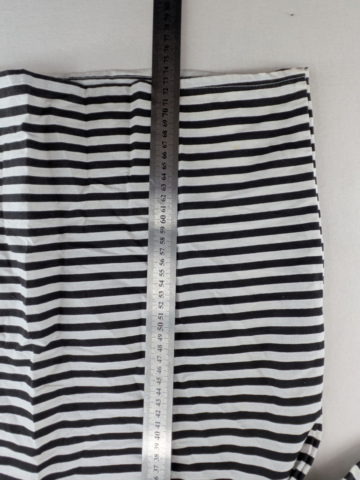 Rubie's costume set black and white striped with prisoner number patch on chest.