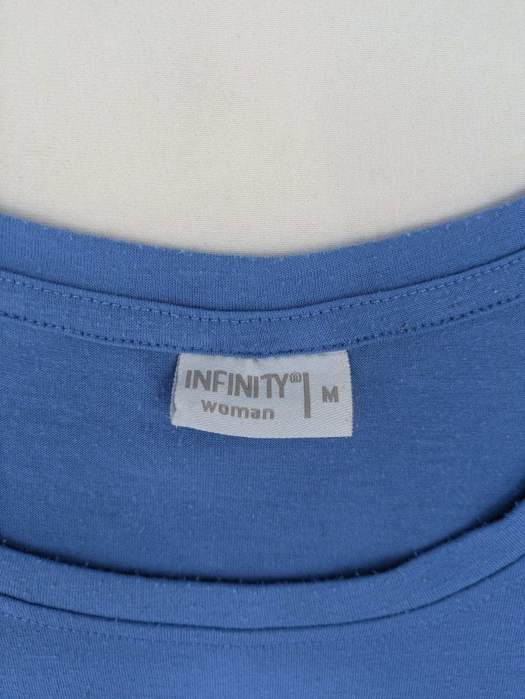 Infinity blue T-shirt dress A-line cut with playful flutter sleeves and soft stretch fabric.