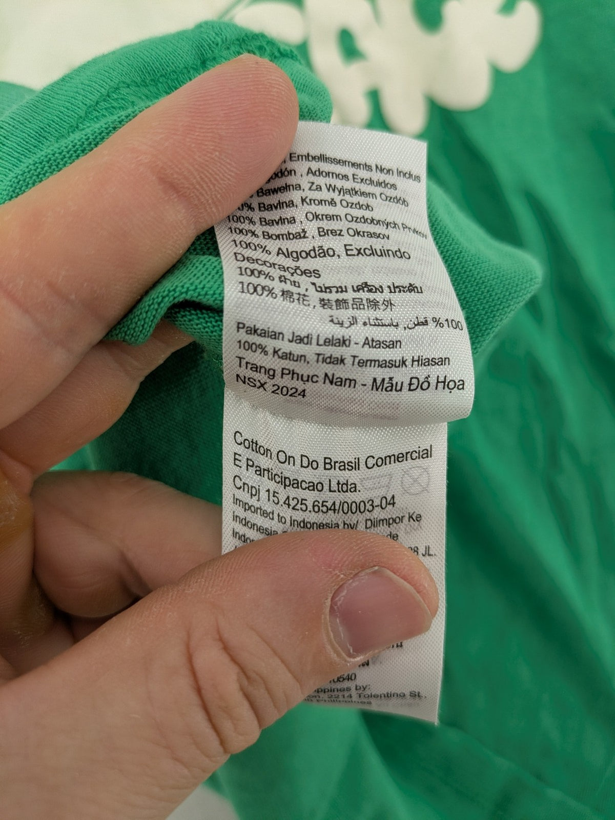 Myla green graphic t-shirt with large peace earth print and front pocket design.