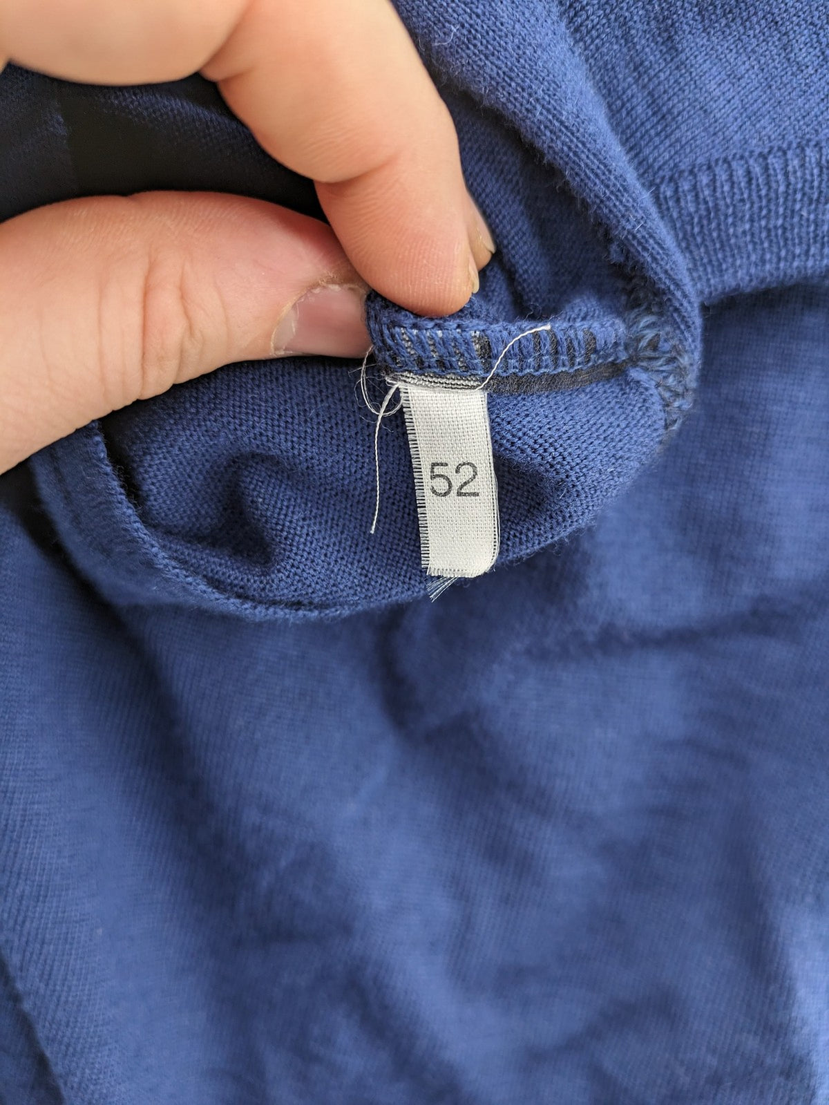 Montechiaro blue turtle neck jumper with V-neck, button placket, and sleeveless design.
