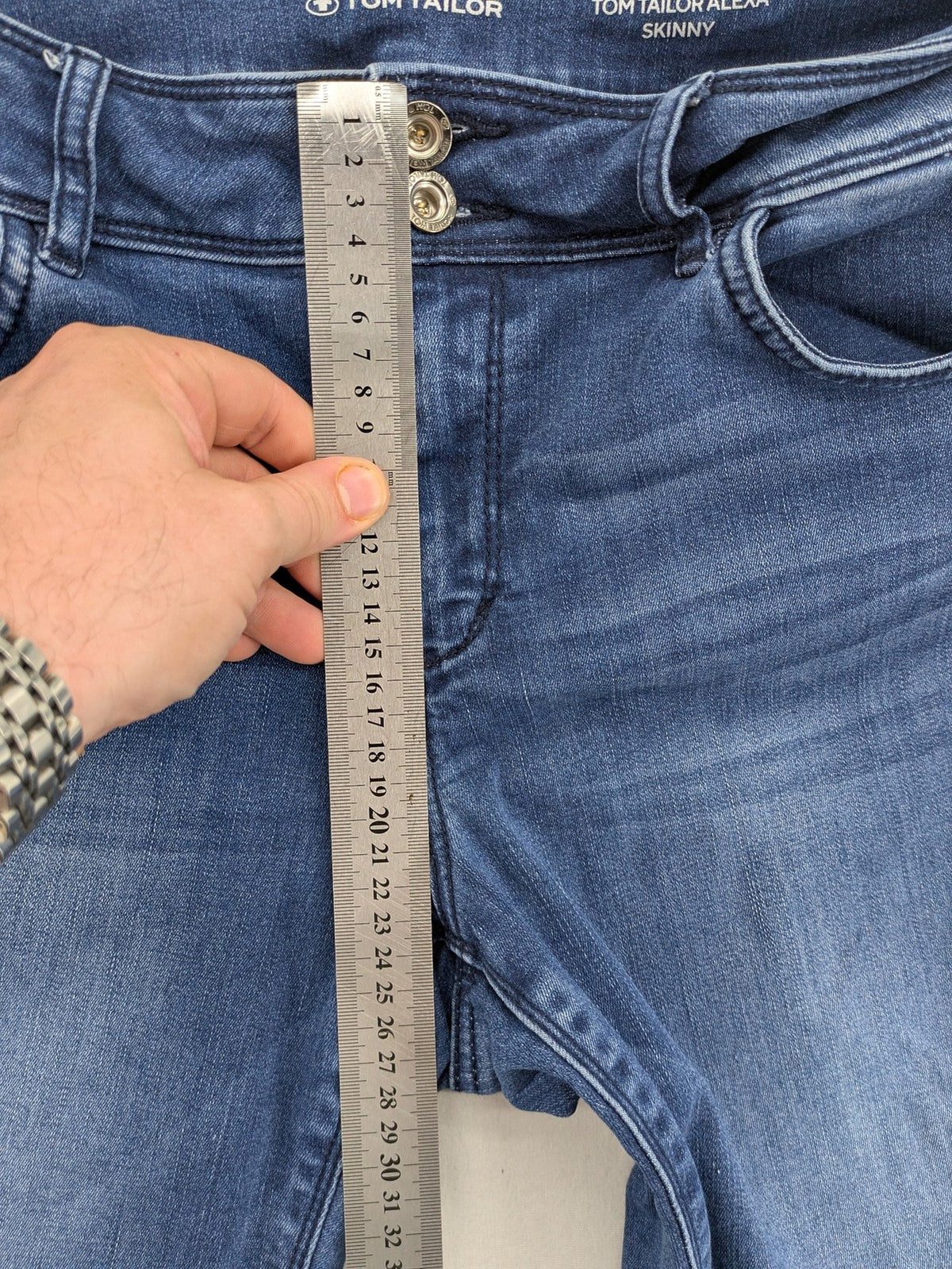 Tom Tailor blue skinny jeans with classic 5-pocket design and double button closure.