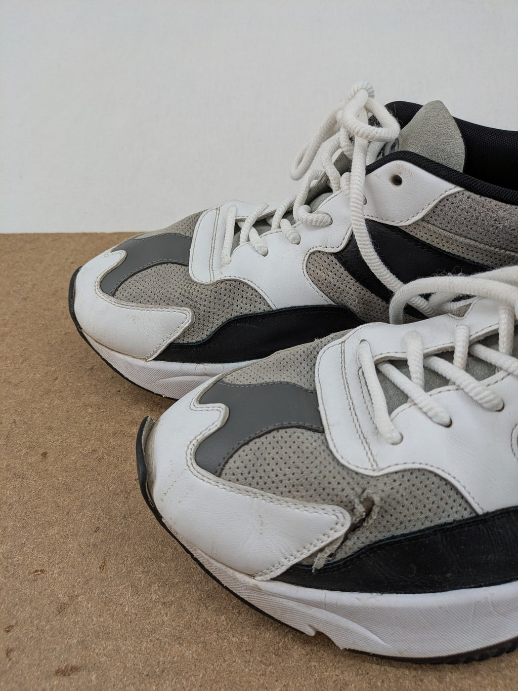 Ellesse Aurora chunky sneakers white grey with orange accents and multi-material upper.
