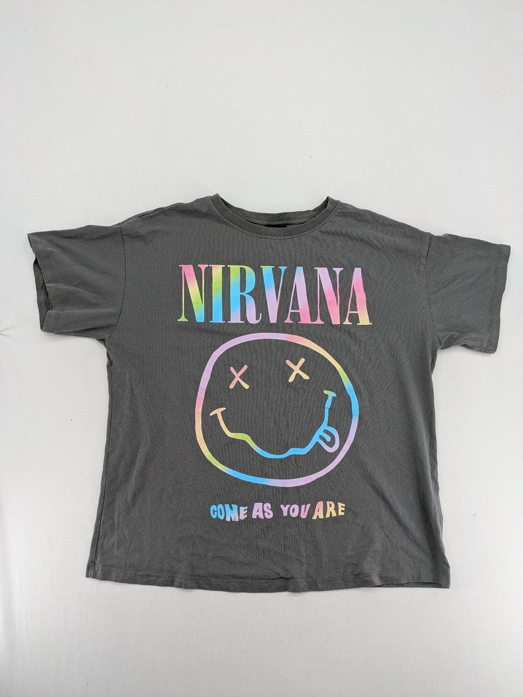 Nirvana grey t-shirt with rainbow Smiley logo and "Come As You Are" text.