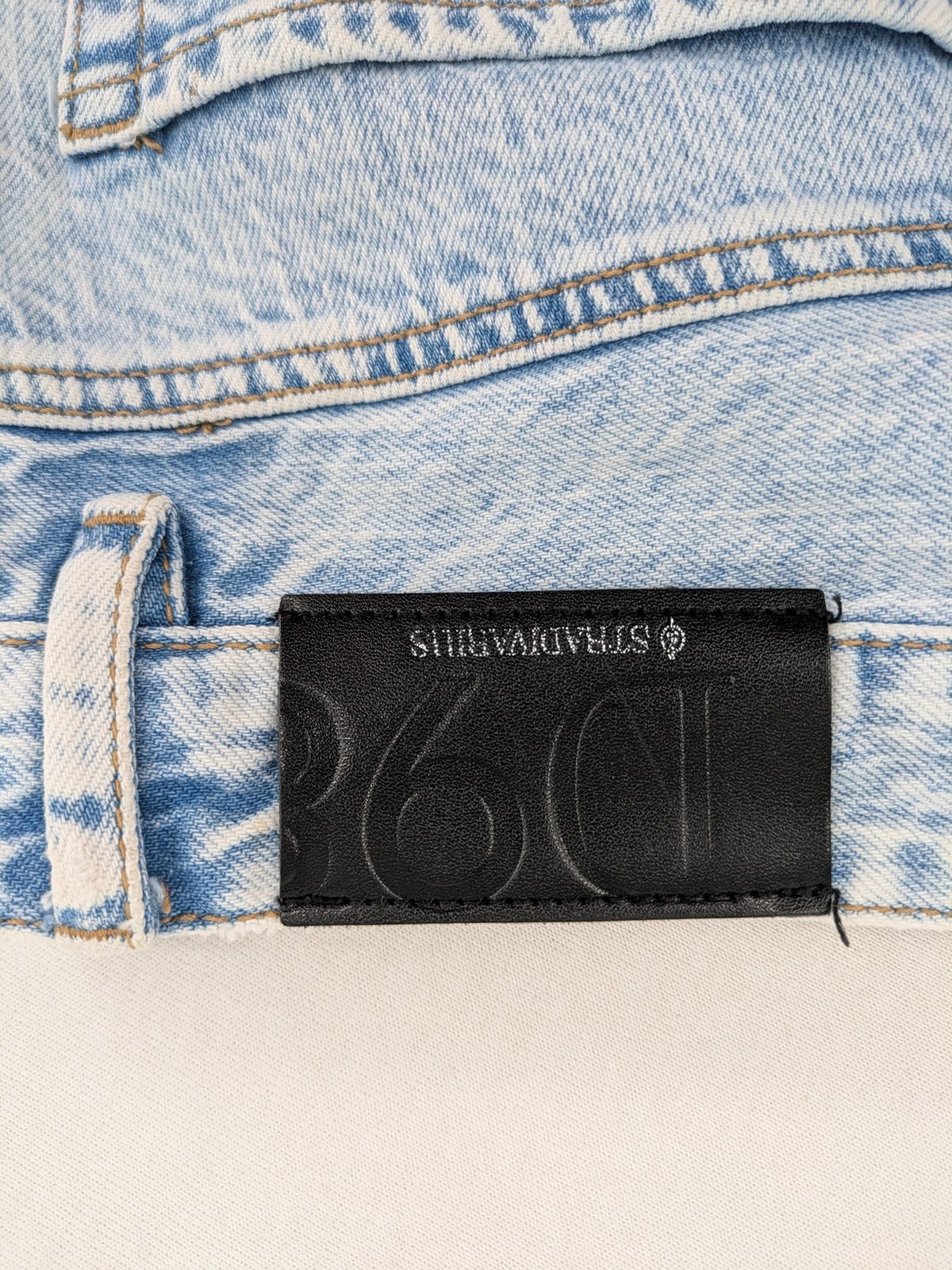 Stradivarius blue high waist flare jeans with acid wash and classic five-pocket design.