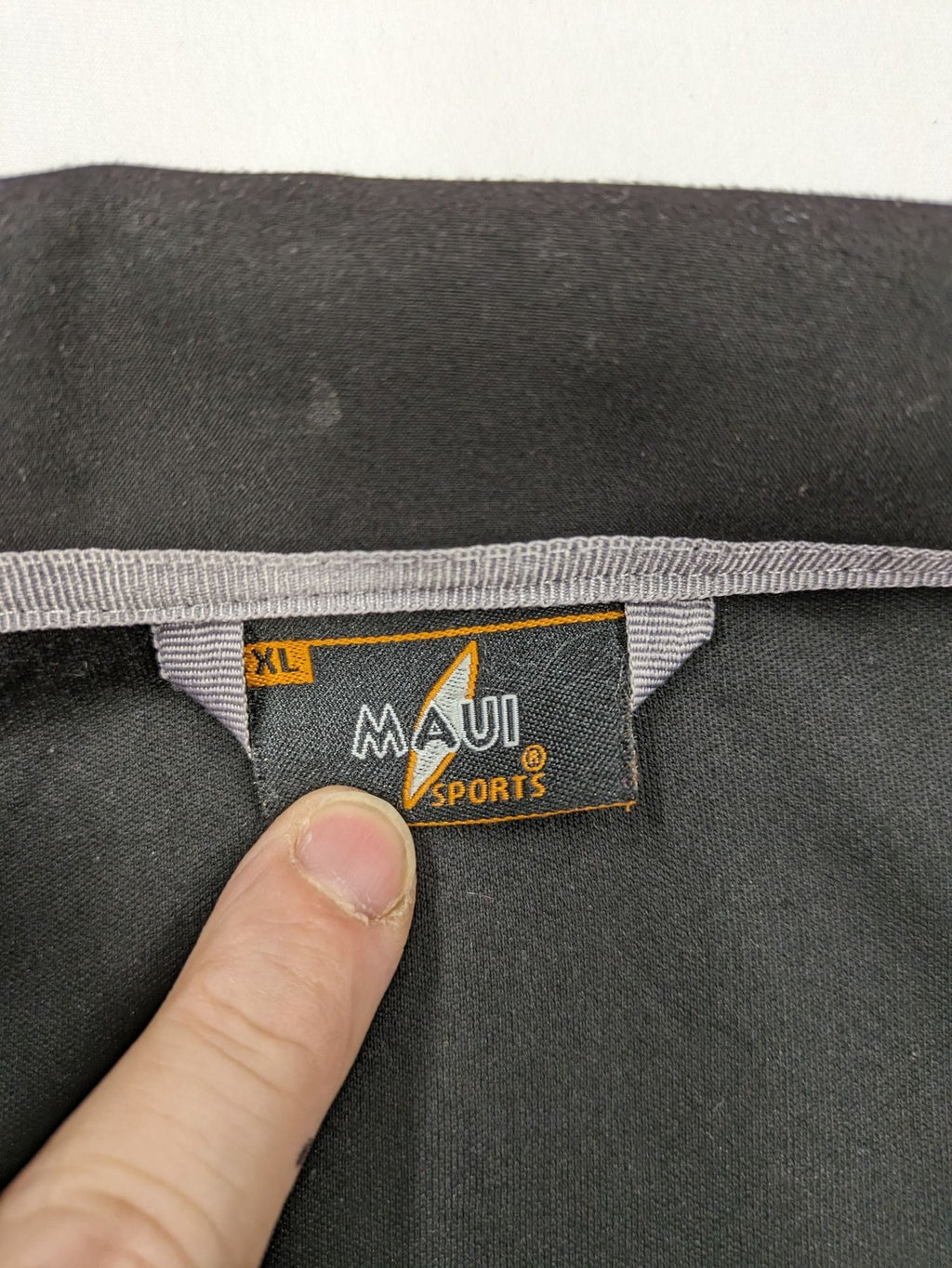 Maui Sports grey softshell jacket XL with contrasting yellow zipper and multiple pockets.