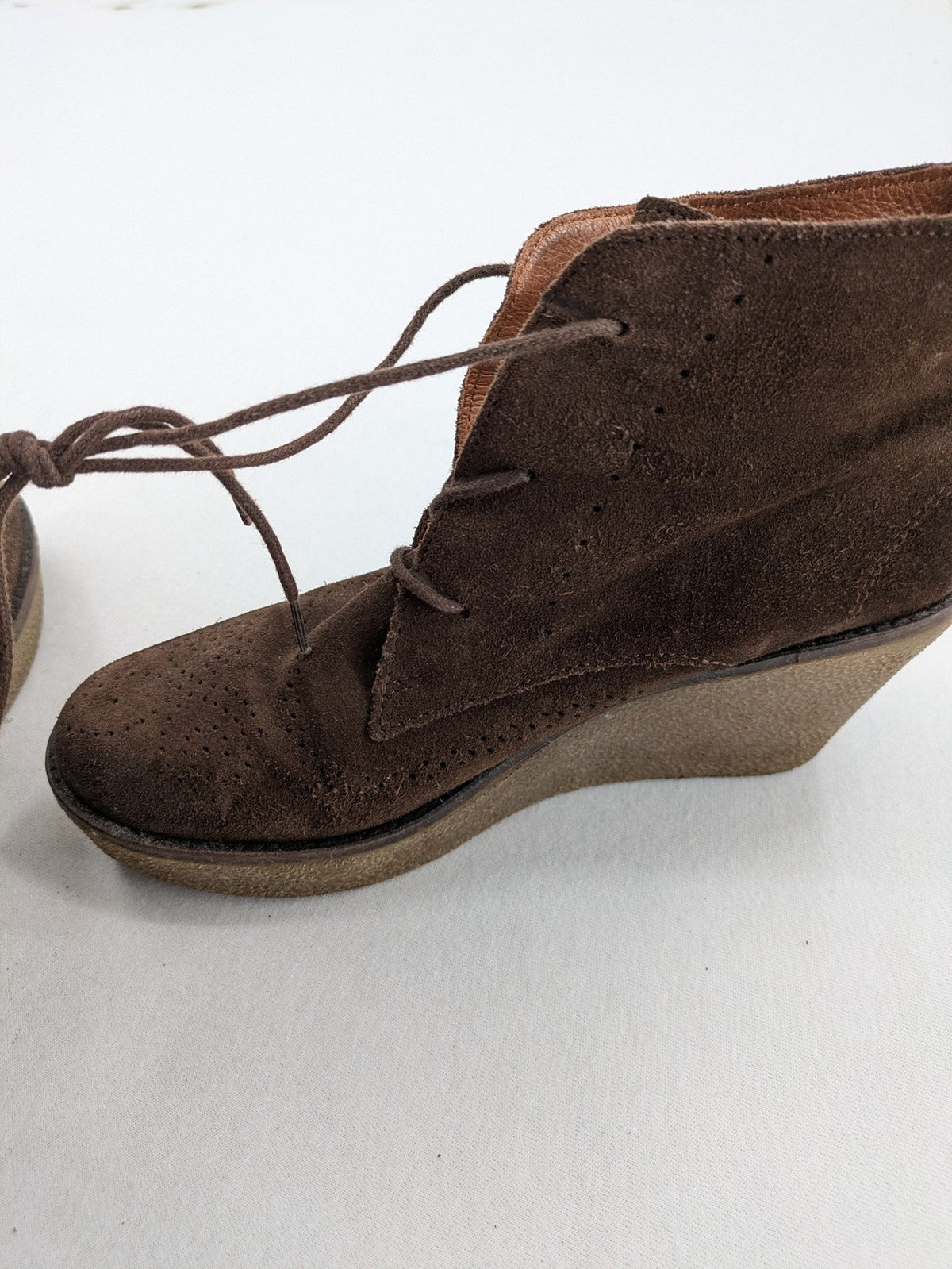 Marc O'Polo brown suede ankle boots with wedge heel and classic lacing.