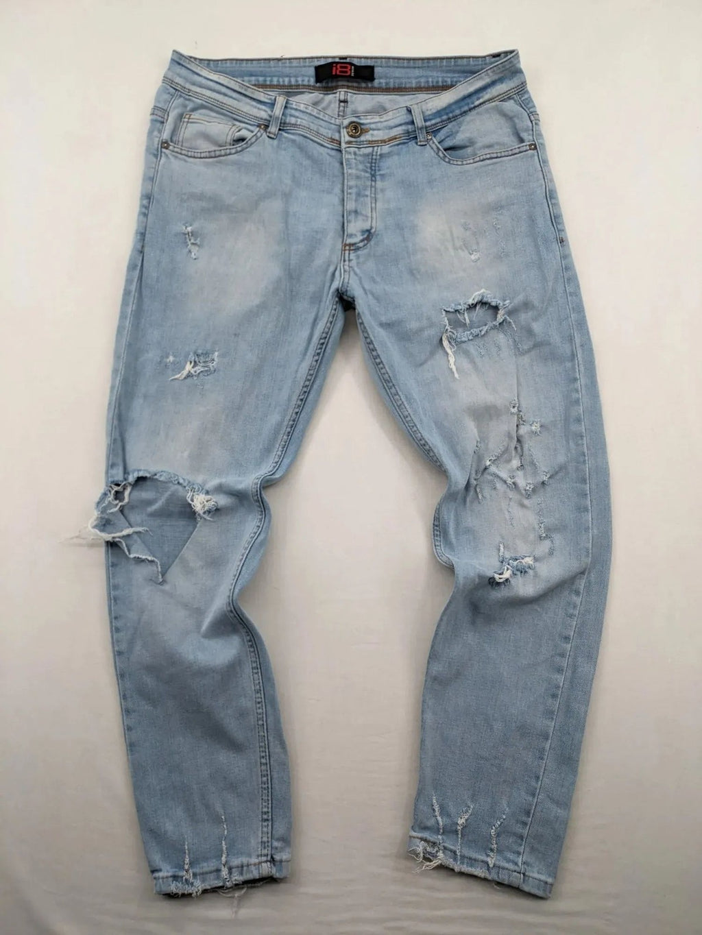 i8 Denim blue straight jeans destroyed look with frayed hems and classic button fly.