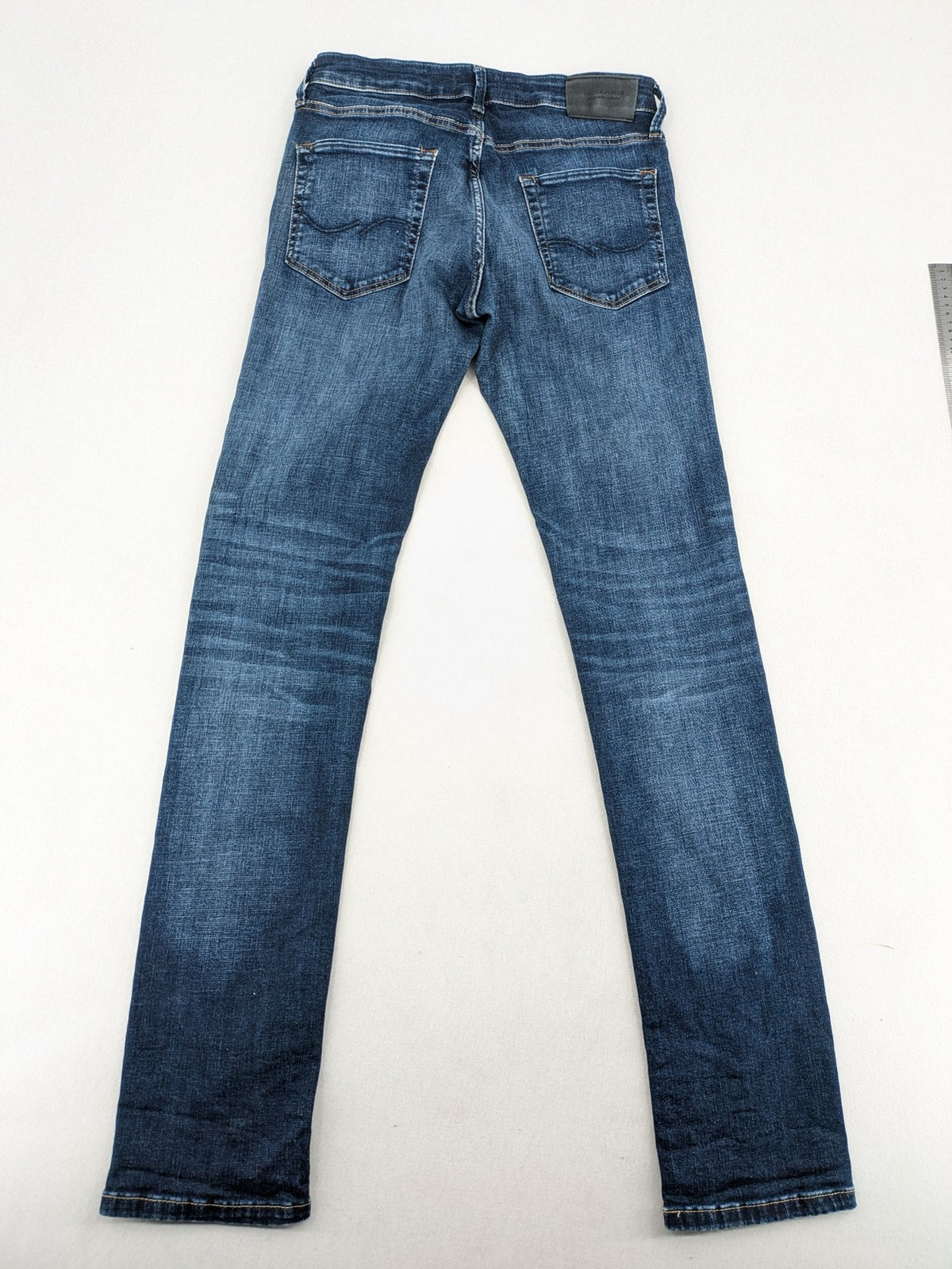 Jack & Jones blue slim fit jeans with faded wash and classic button fly.