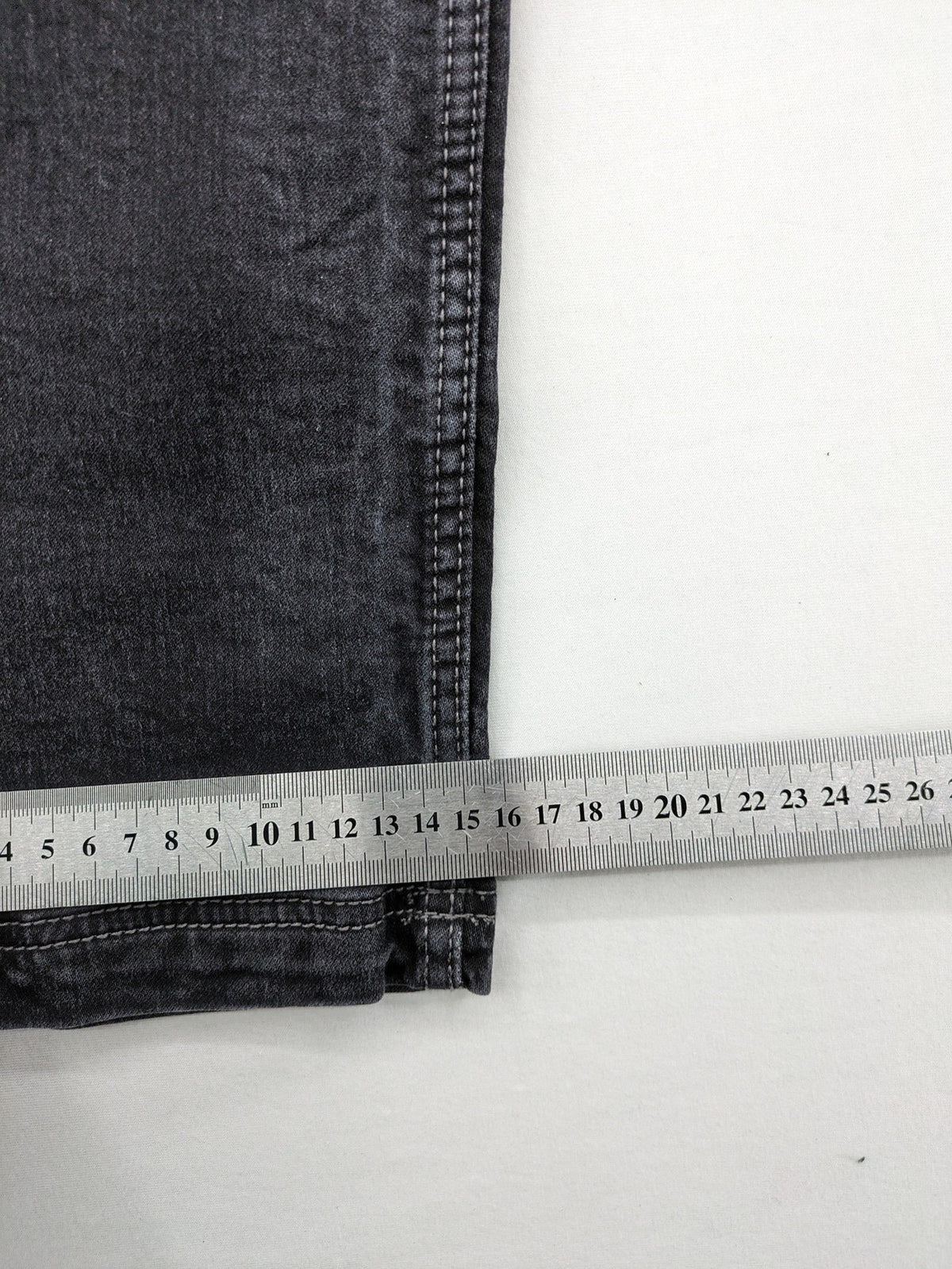 Tom Tompson grey slim tapered jeans with washed denim finish and subtle branding.