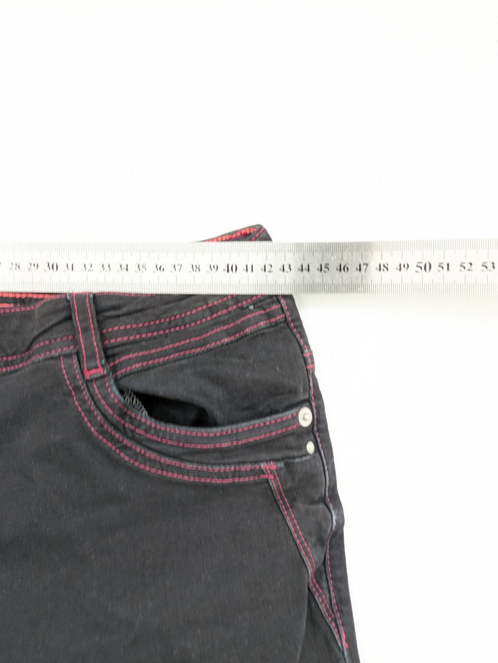 Denim black straight jeans with pink contrast stitching and classic 5-pocket style.