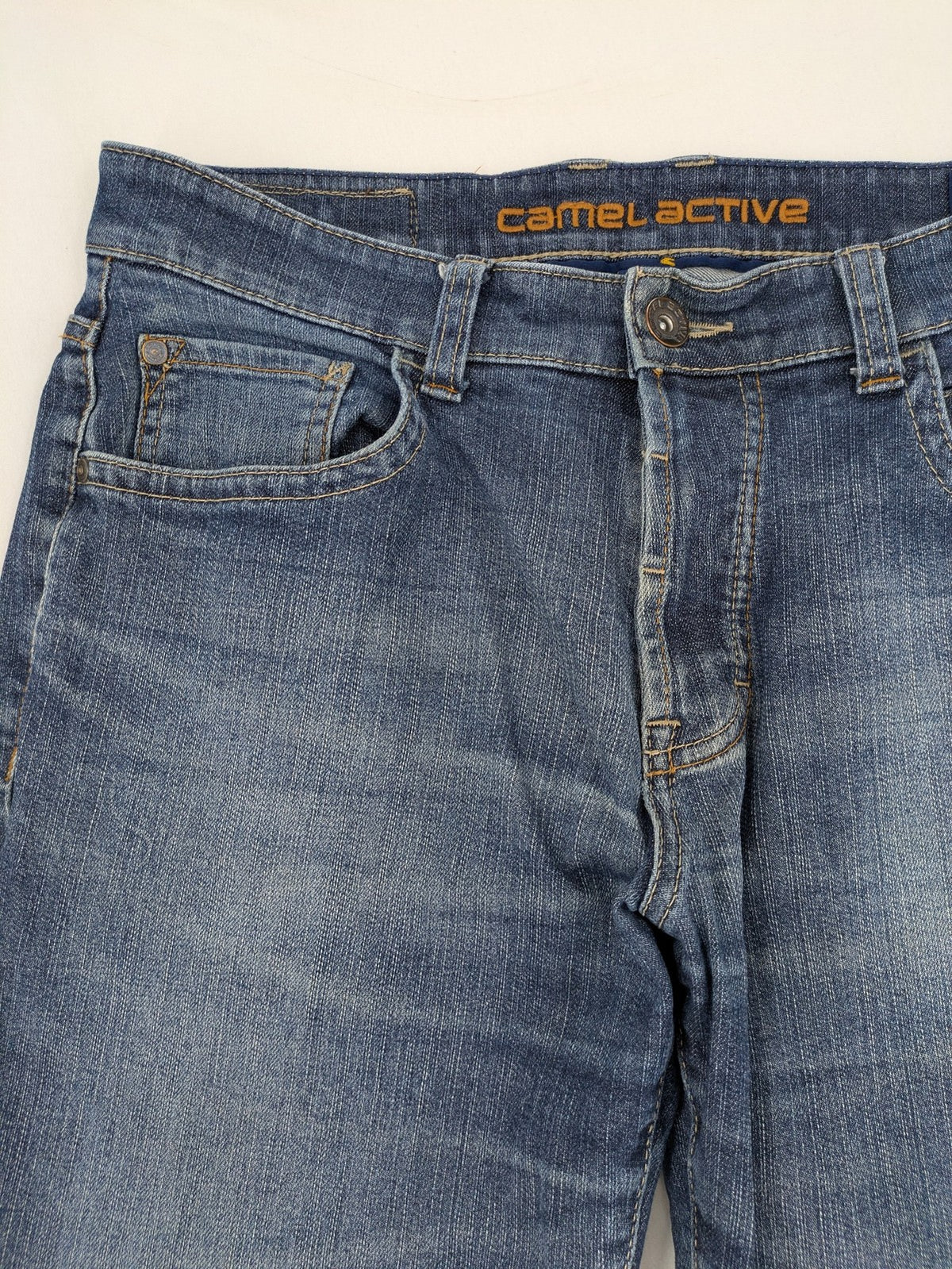 Camel Active blue straight jeans with classic 5-pocket design and logo patch.