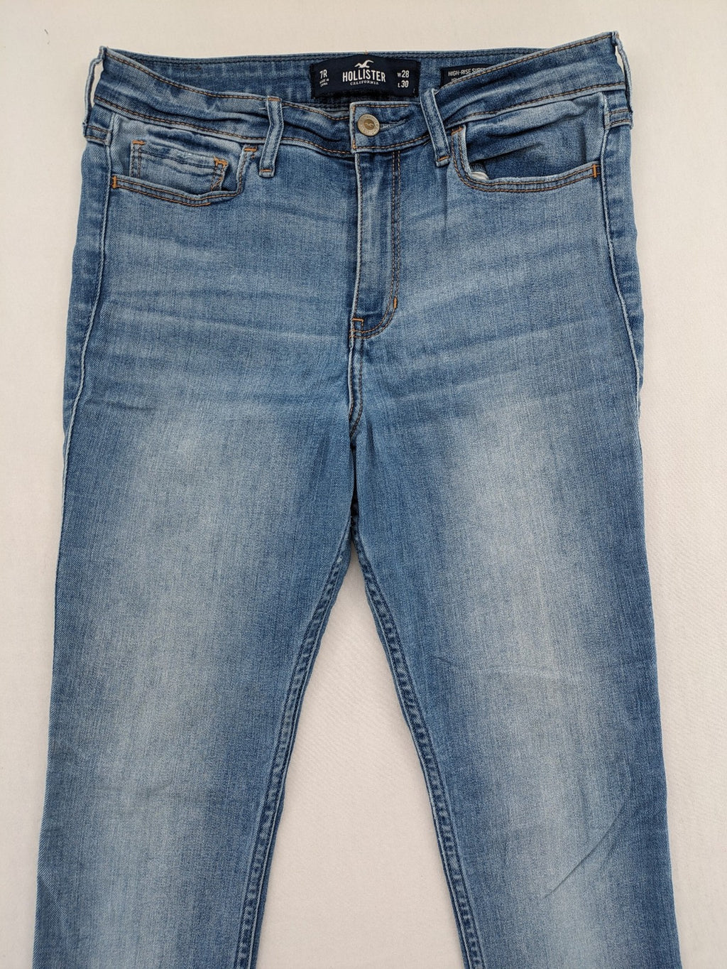 Hollister blue high rise super skinny jeans with frayed hem and classic stretch denim.