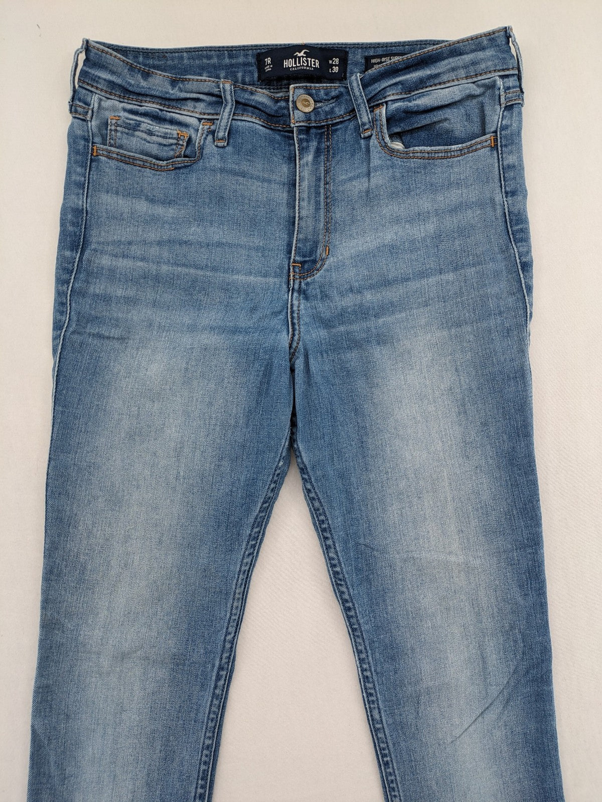 Hollister blue high rise super skinny jeans with frayed hem and classic stretch denim.