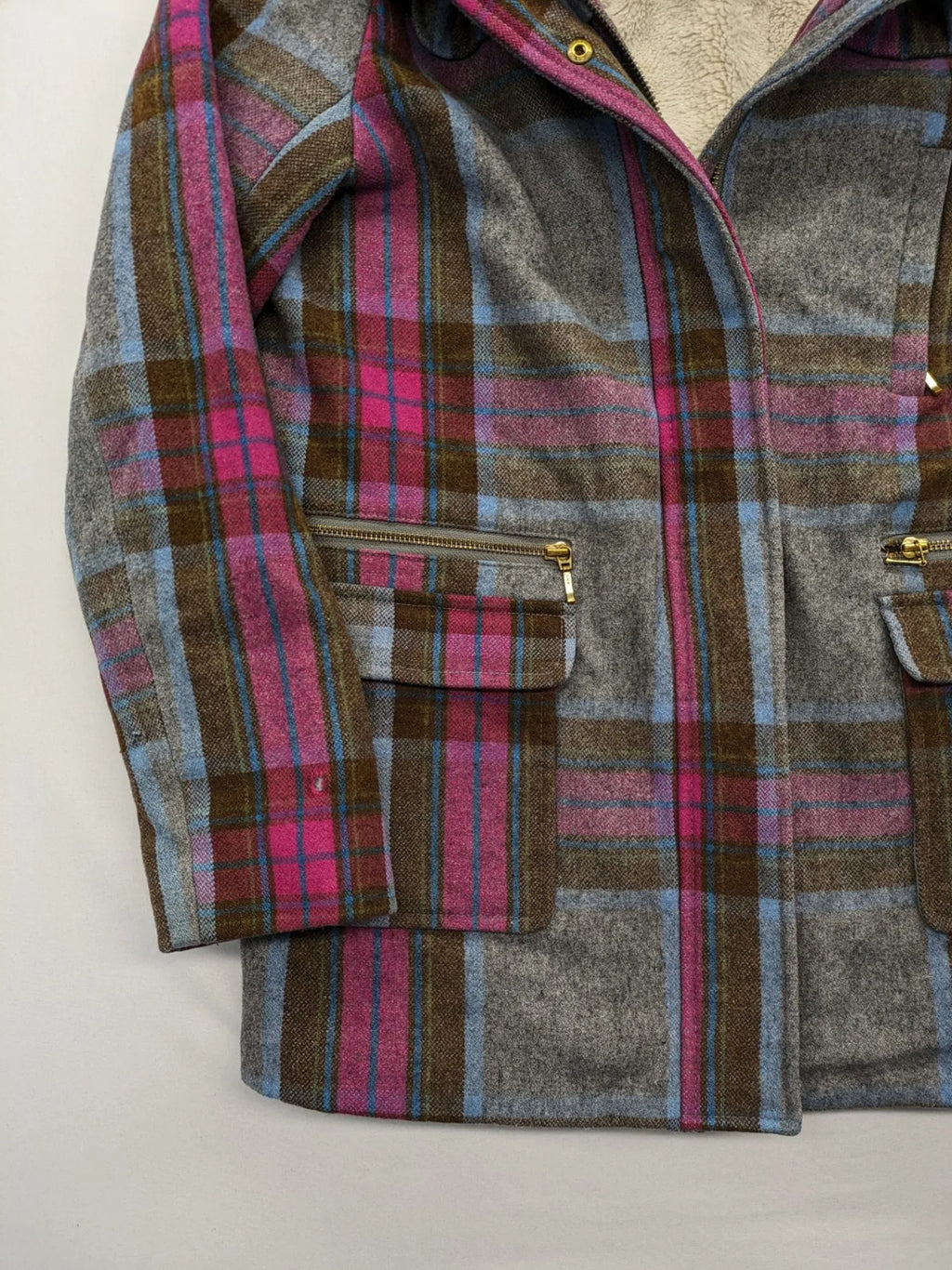 Johnnie B pink coat with gray check pattern, Sherpa lining, and zip closure.