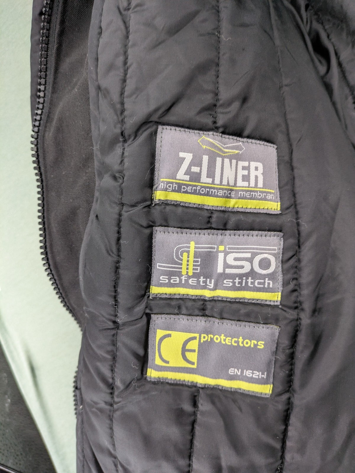 Advanced Experience black motorcycle jacket with Z-Liner membrane and CE protectors, durable Cordura material.