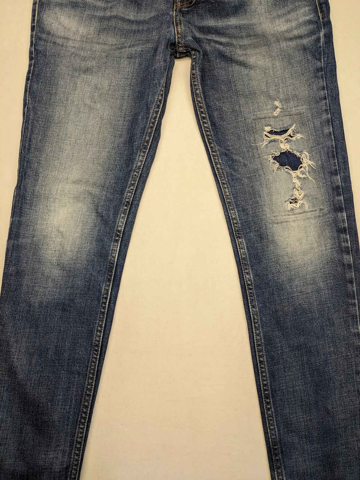 Hollister blue slim fit jeans with distressed detailing and classic button fly.