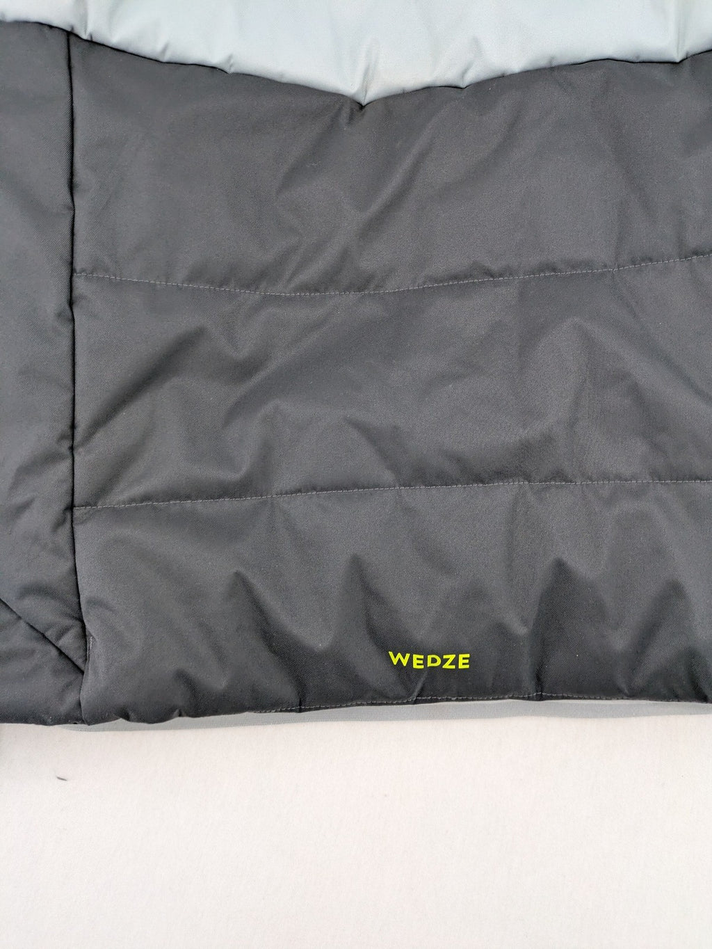 Wedze ski coat grey and black colorblock design with neon accents and fleece lining.