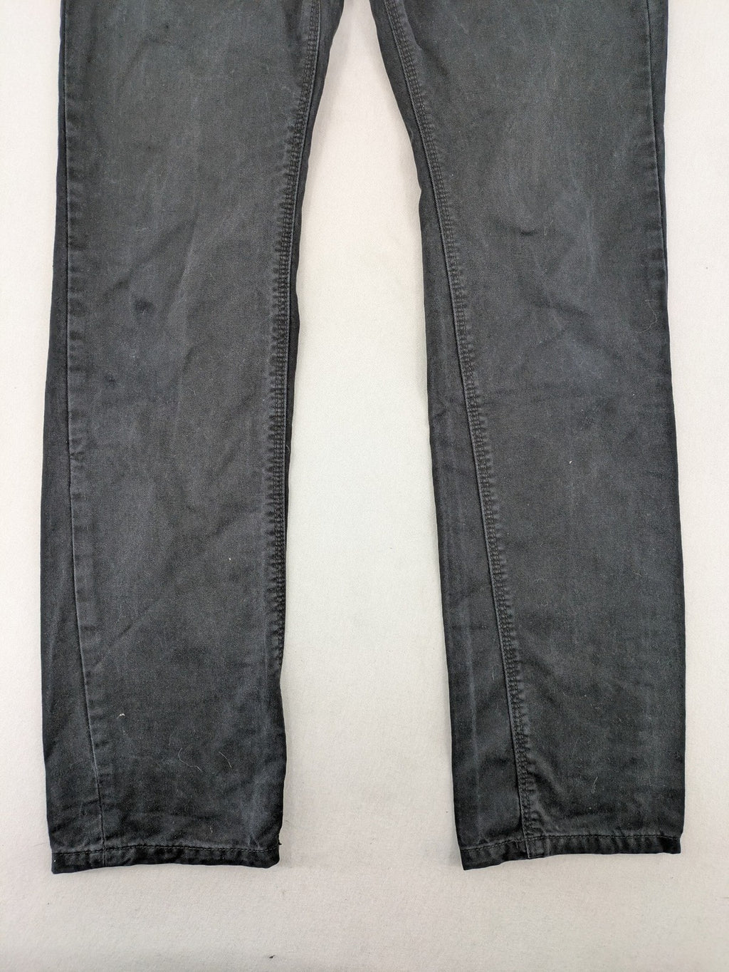 Ckh grey straight fit jeans with button fly and faded wash details.