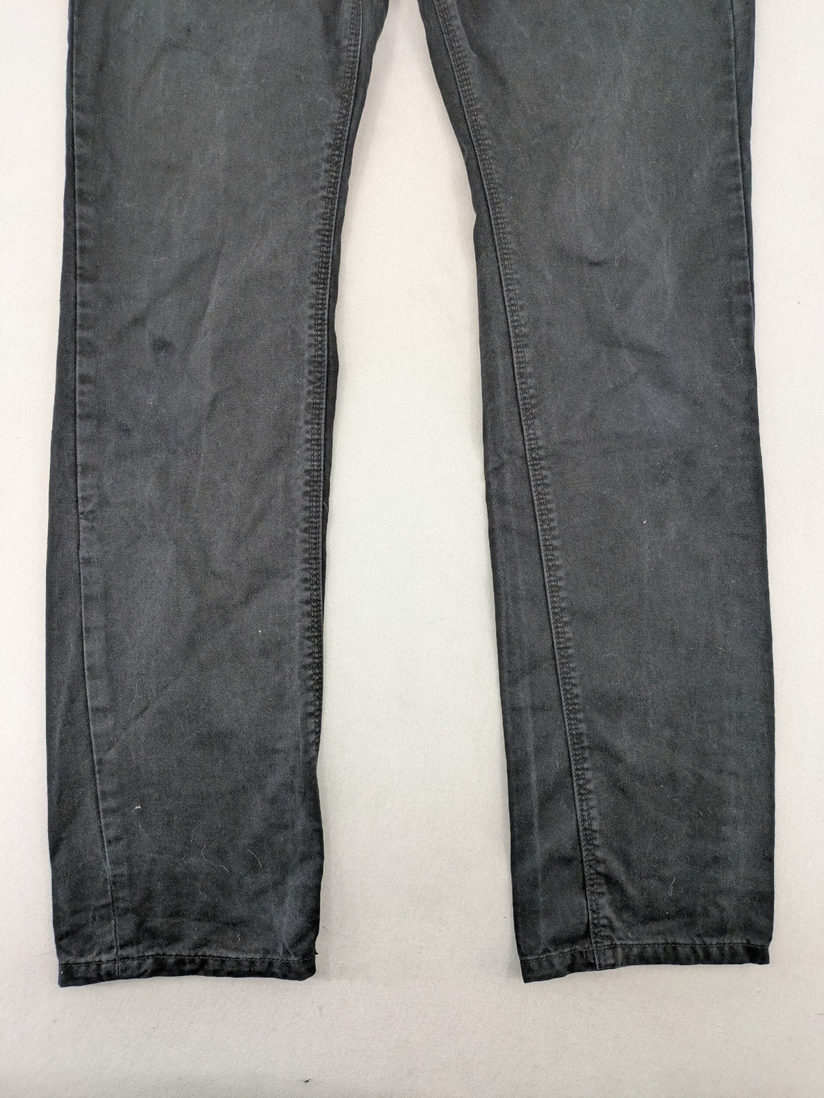 Ckh grey straight fit jeans with button fly and faded wash details.