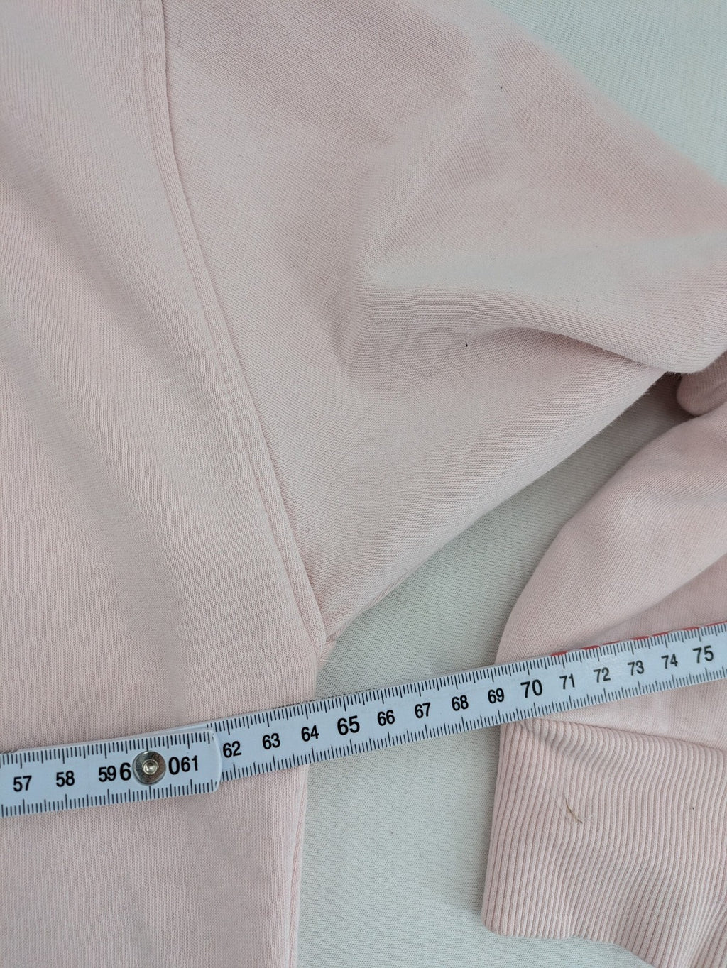 Hello Kitty pink sweatshirt classic graphic face logo on chest, long sleeves, round neck.