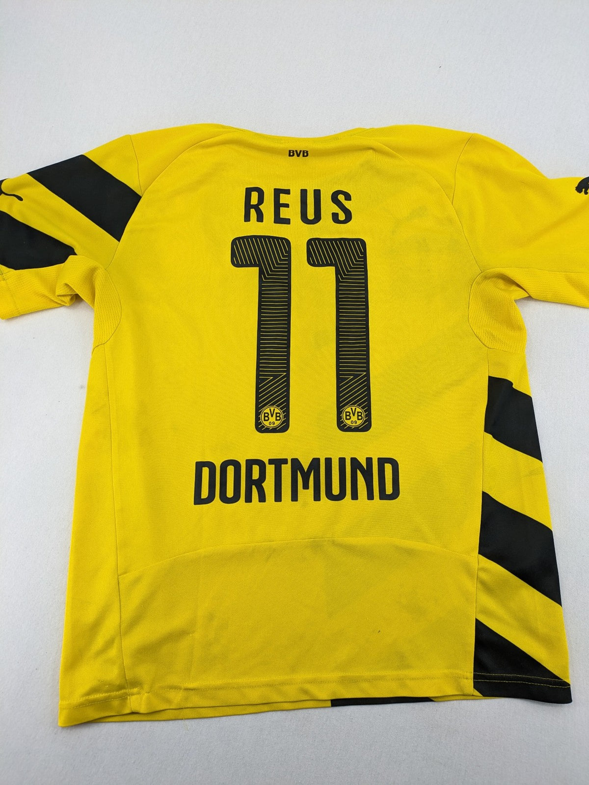 Puma black and purple soccer uniform with yellow accents, Reus #11, "Derbysieger 2015" print.