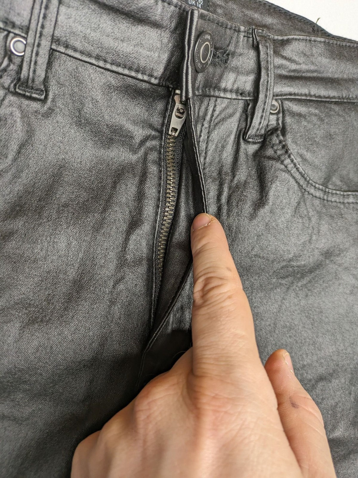 Stradivarius black coated straight jeans with leather-like finish and stretchy material.