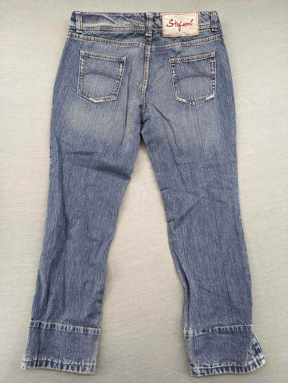 Stefanel blue straight jeans with cuffed hem and classic 5-pocket design.