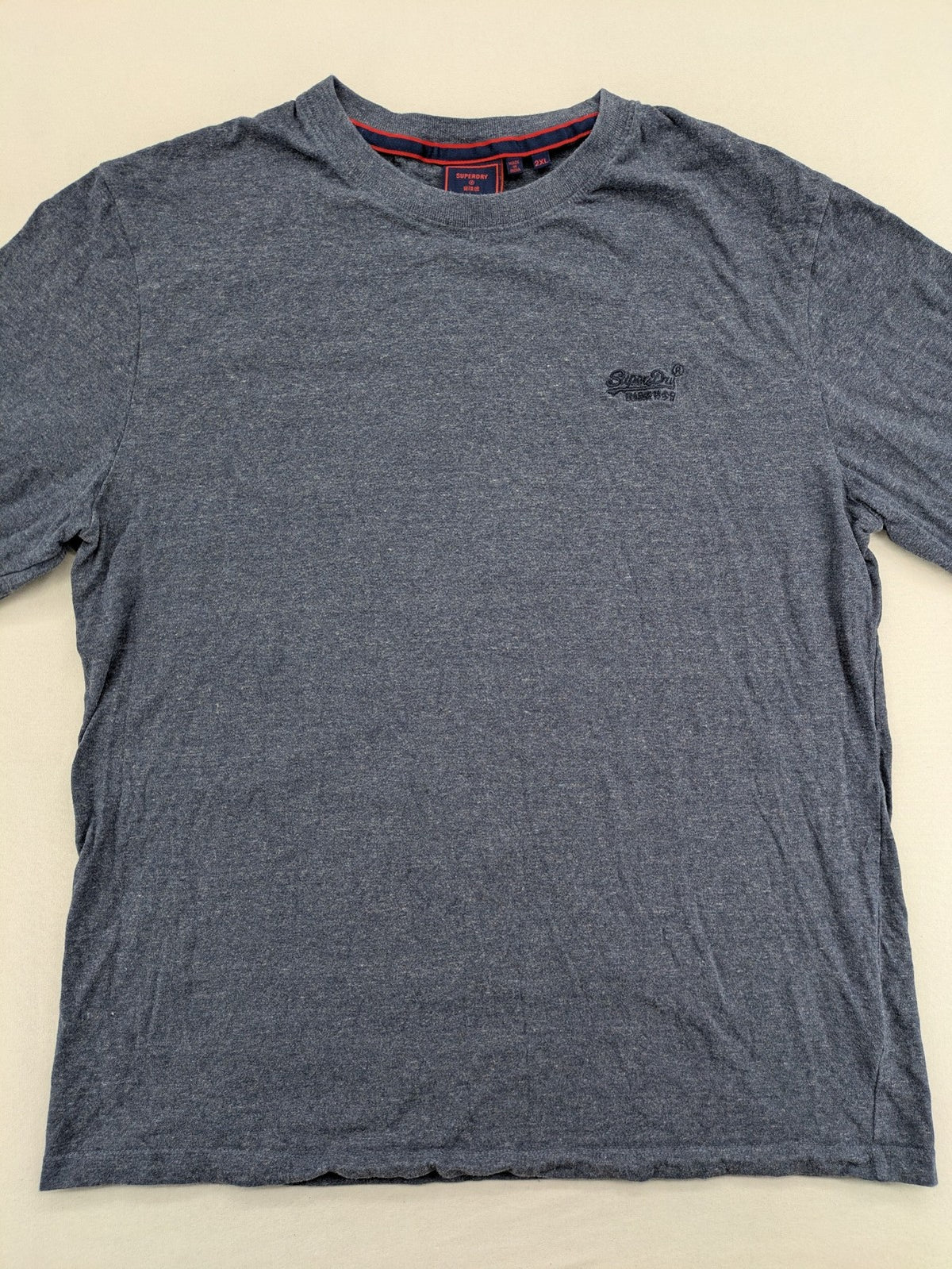 Superdry grey long sleeve shirt melange with embroidered logo and red collar accent.