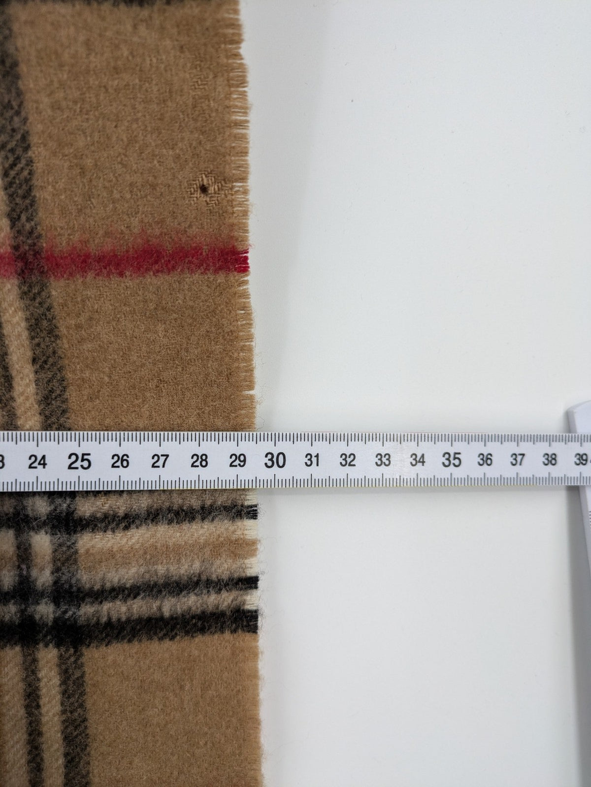 Karo unisex scarf camel brown tartan pattern 100% cashmere with black, white, and red accents.
