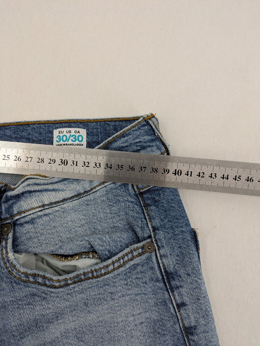 FSBN blue straight jeans with ripped distressed knees and classic button fly.